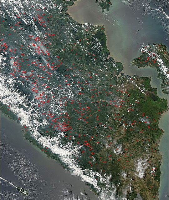 Satellite image shows fire hotspots and smoke over Sumatra, Indonesia